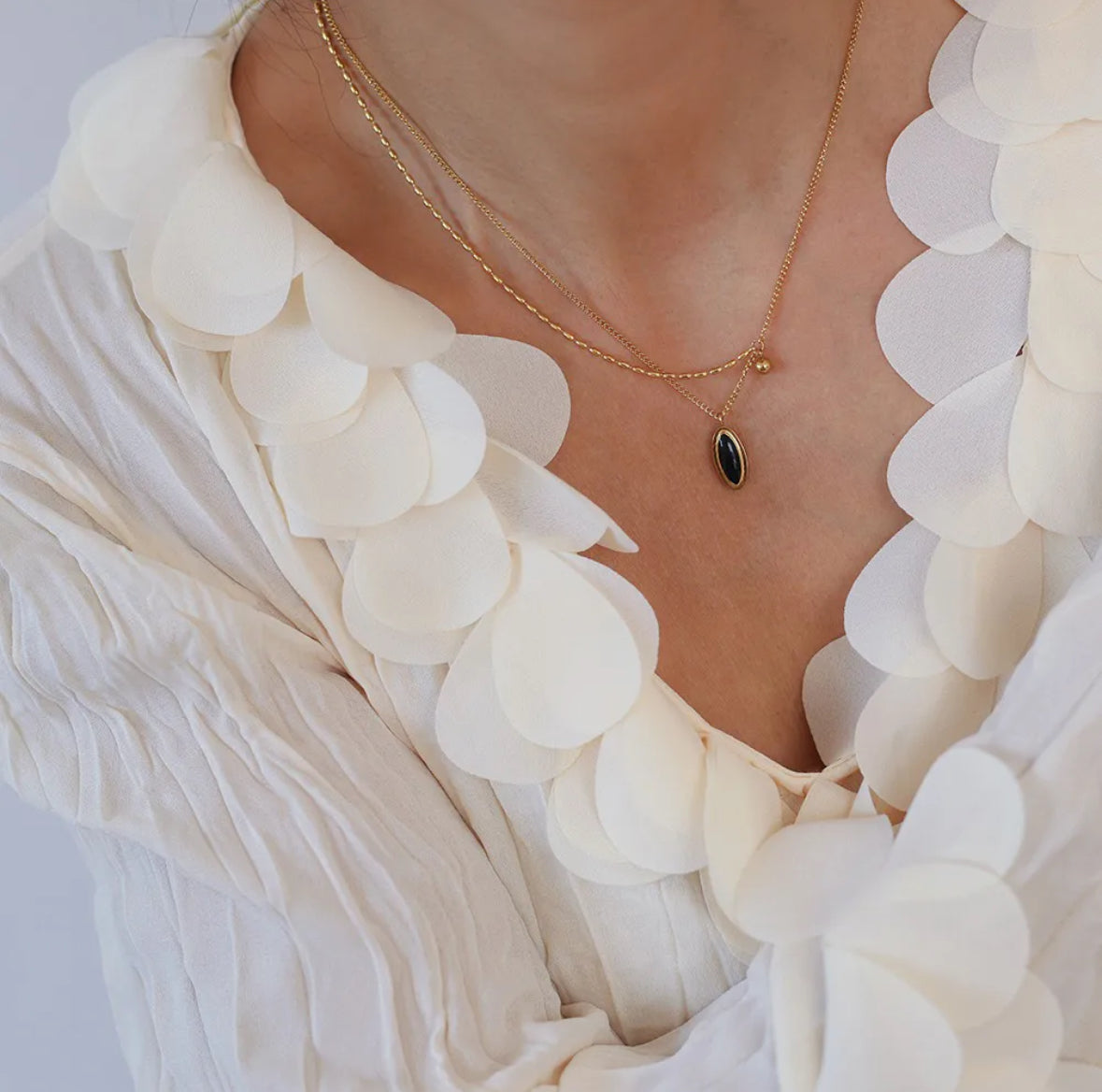 Stainless Steel Necklace with a Black Oval Pendant